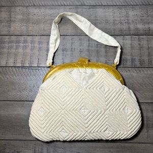Vintage cream colored quilted handbag
